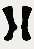 een paar zwarte bamboe sokken met een badstof zool